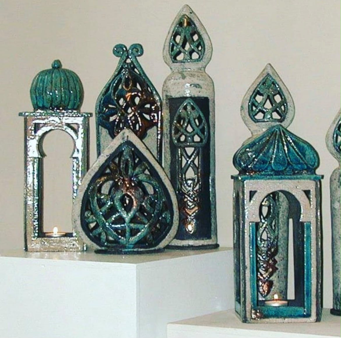 Group of turquoise, green and earth-toned raku-fired ceramic forms